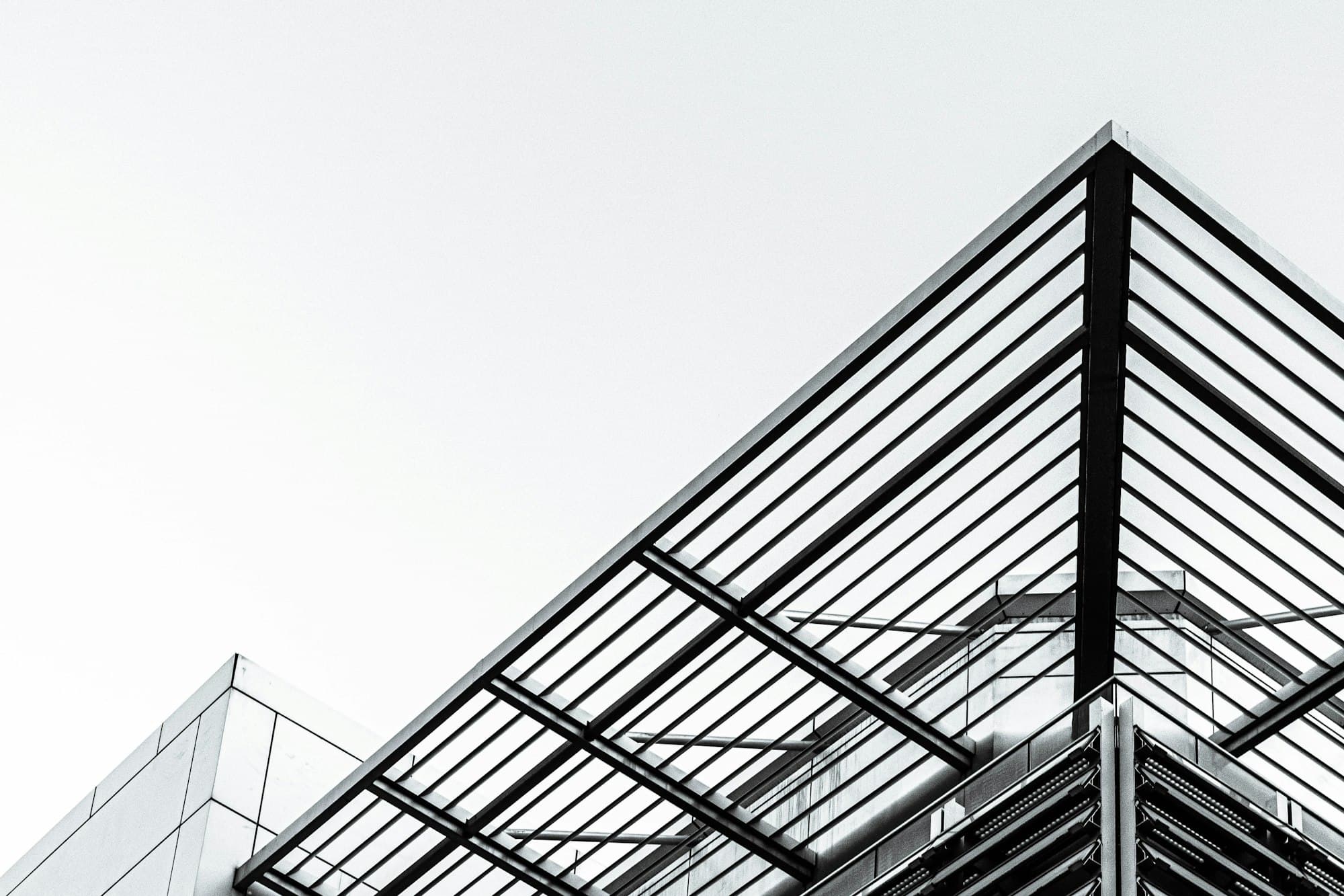 Architectural steel framing against an open sky