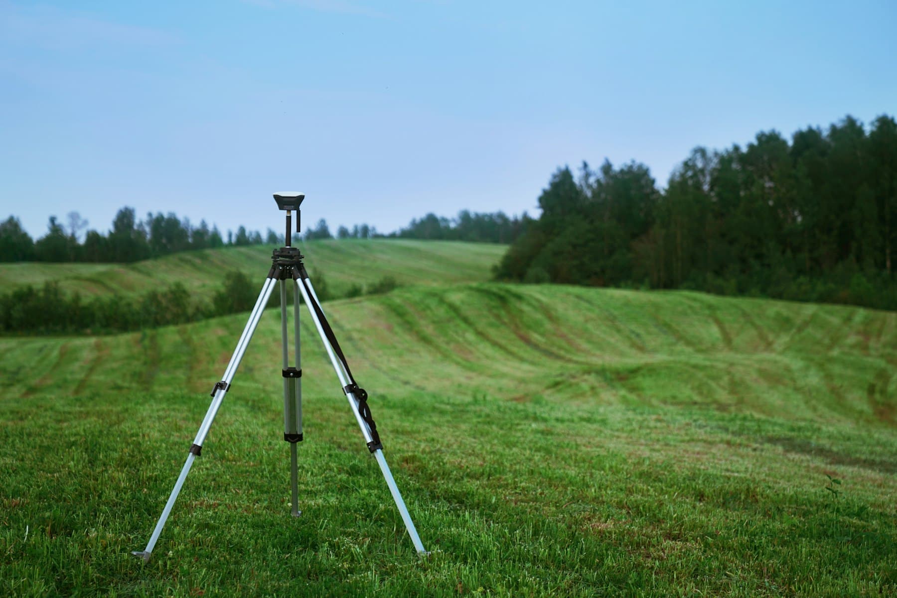 Survey instrument set up on open ground